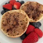 Picture of Honey Cinnamon Almond Butter Toast on a plate served with fresh strawberries and blueberries.