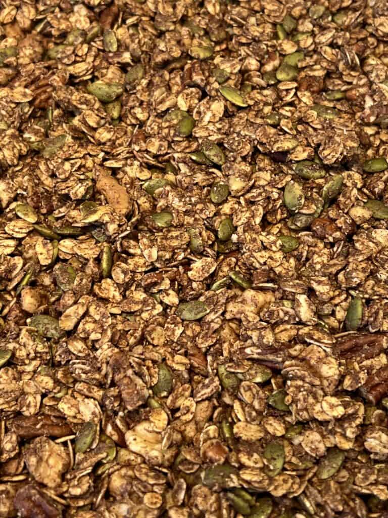 Picture of chai spiced granola on a sheet pan.