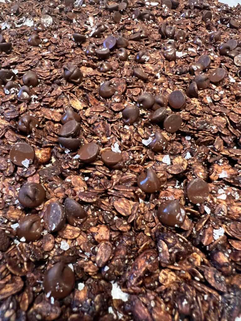 Picture of dark chocolate sea salt granola on a sheet pan.
