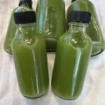 Picture of green juice wellness shot bottles.