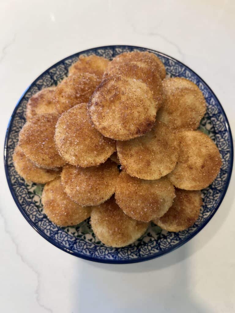 Picture of Baked Apple Cinnamon Doughnut Holes on a blue plate. 