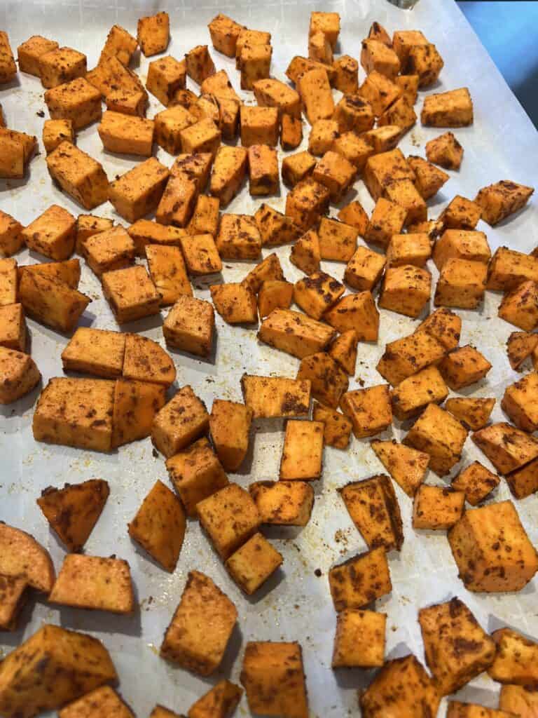 Picture of Lily's Spiced Sweet Potatoes on a backing sheet ready to go into the oven.