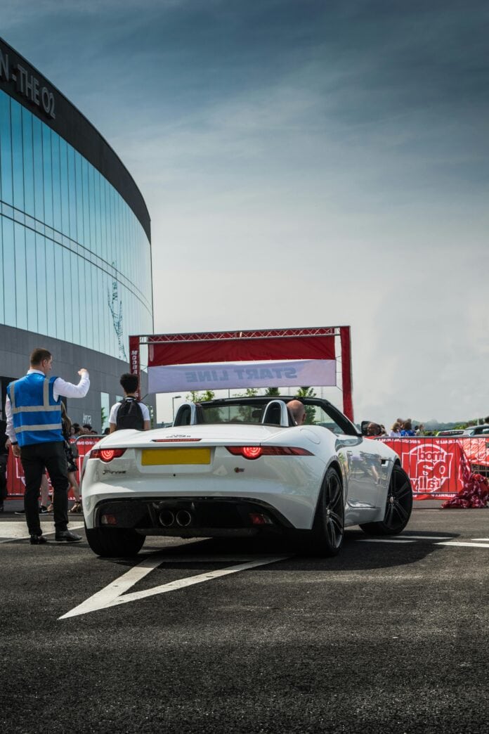 A White Jaguar F Type Luxury Car Parked on Asphalt Road - london uk