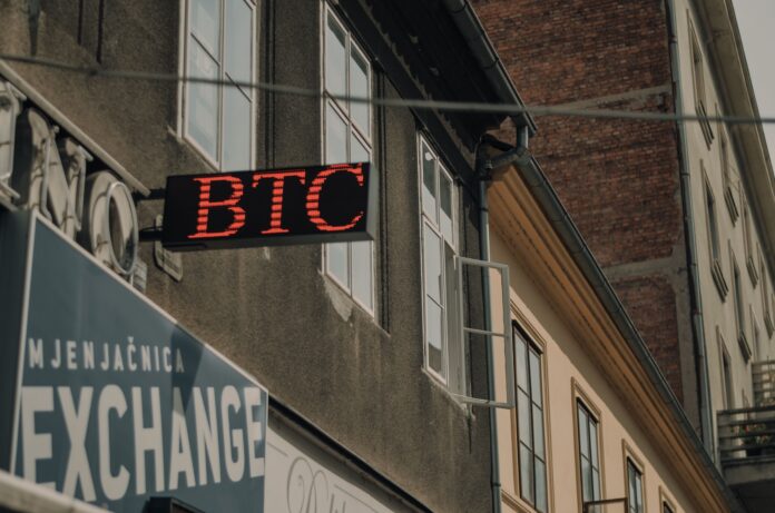 btc-sign-wall-street