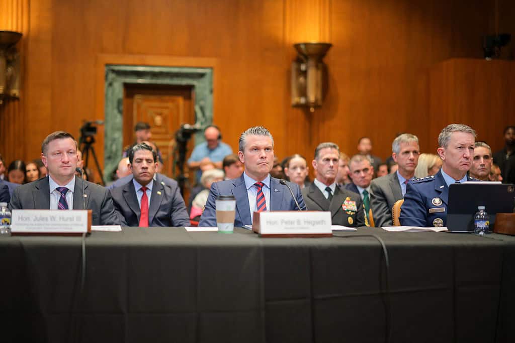 WASHINGTON, DC - MAY 12: (L-R) U.S. Under Secretary of Defense Comptroller Jules Hurst, U.S. Secretary of War Pete Hegseth and Chairman of the Joint Chiefs of Staff Gen. Dan Caine appear before the Senate Appropriations Committee on the FY2027 budget request in the Dirksen Senate Office Building on Capitol Hill on May 12, 2026 in Washington, DC. The Trump administration is asking for an unprecedented $1.5 trillion for the Pentagon, an increase of 50-percent over last year's budget. (Photo by Chip Somodevilla/Getty Images)