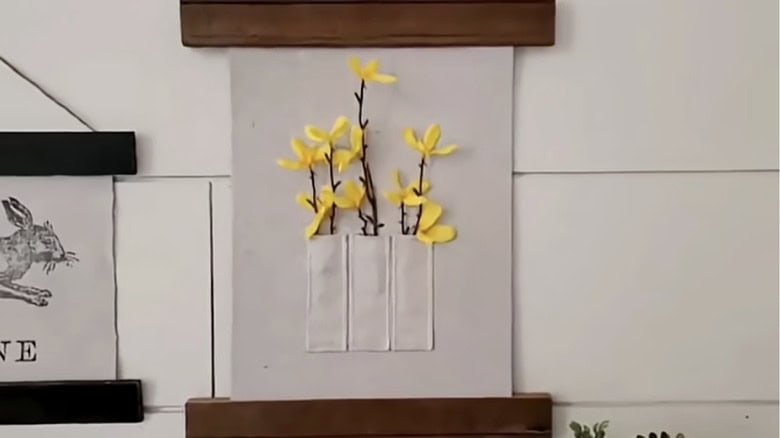 Customizing drop cloth craft with ribbons and flowers
