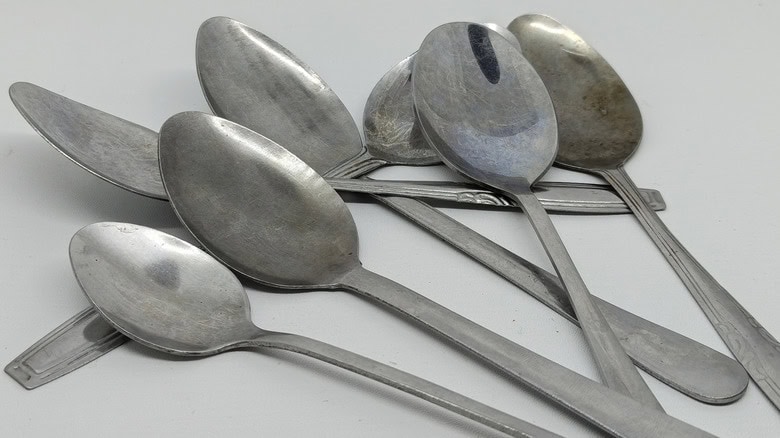 Old spoons stacked against each other