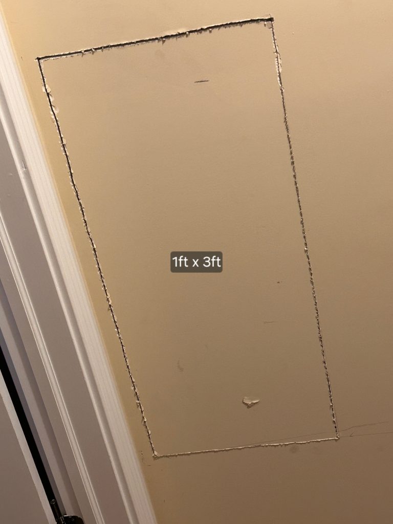 Drywall patch with clean edges for seamless repair.