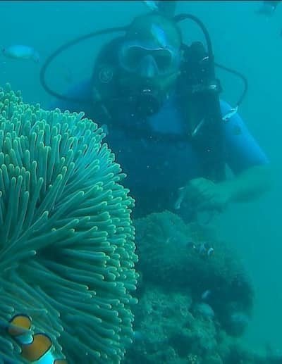 A photo of Devraj scuba diving in the clear waters of the Andaman and Nicobar Islands, showcasing an adventurous and active lifestyle.