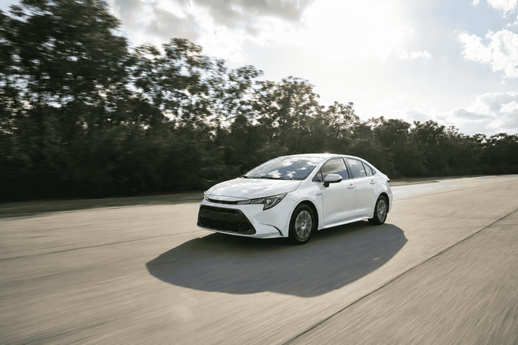 Sleek Toyota Corolla sedan on a sunlit highway