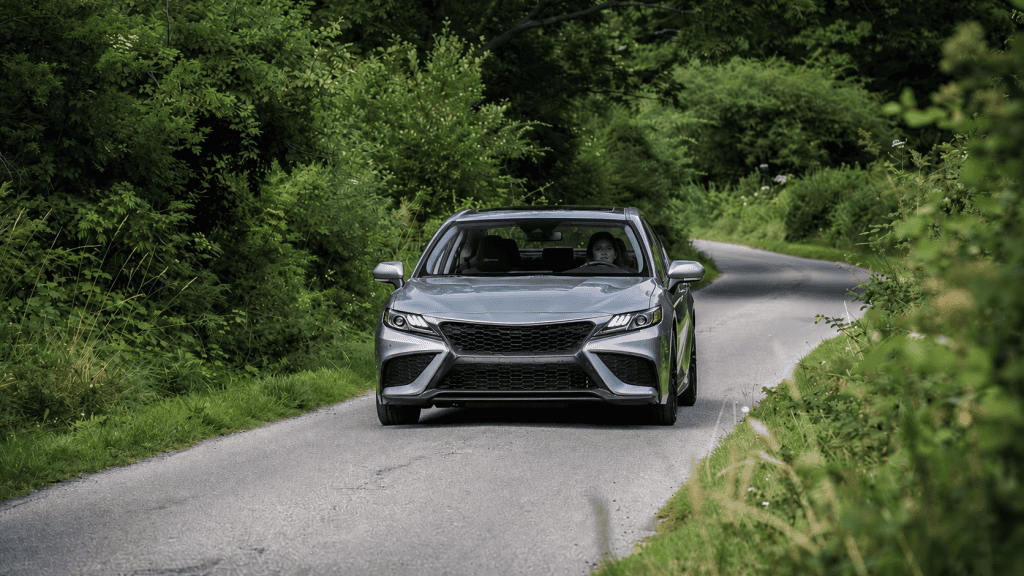 Sleek Toyota Corolla sedan on a winding country road