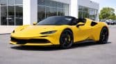 Yellow Ferrari SF90 Spider in showroom_