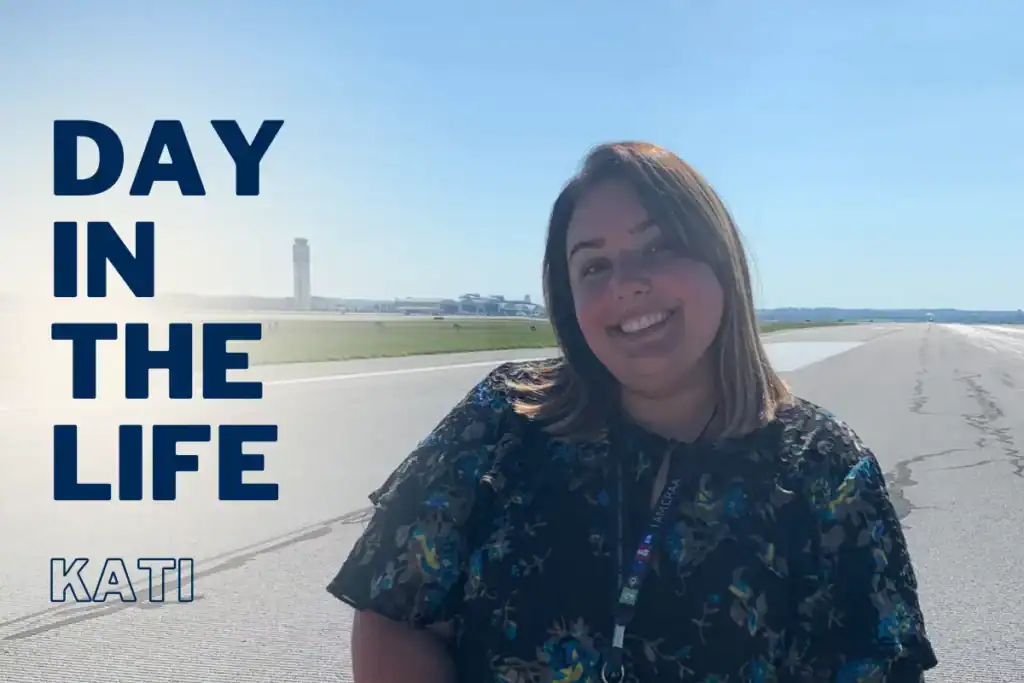 Day in the life, portrait of Kati Hartwig, CRAA employee smiling on the runway at CMH