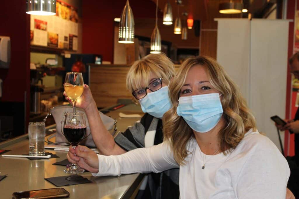 Travelers wearing a mask at John Glenn International Airport