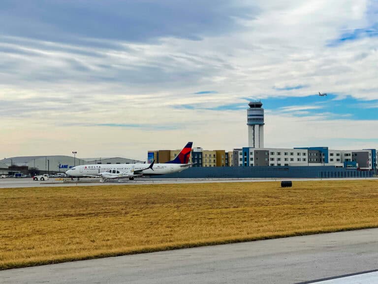 A Delta Air Lines plane taxis along the airfield after landing.