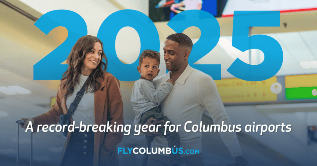 Promotional image for Columbus airports featuring two adults and a child smiling and walking through an airport, with text announcing 2025 as a record-breaking year. The website FlyColumbus.com is visible.