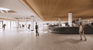 A modern airport baggage claim with high ceilings, wooden accents, two dark baggage carousels, and several people, including a man in a white tank top in the foreground.
