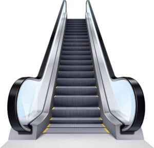 A modern escalator with dark gray steps, yellow safety lines, black handrails, and clear glass side panels, ascending against a white background.