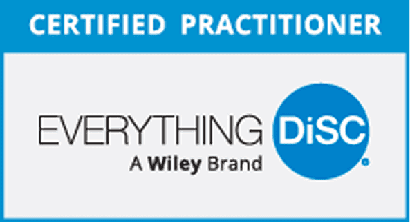 A team engaged in an Everything DiSC workshop to improve workplace communication.