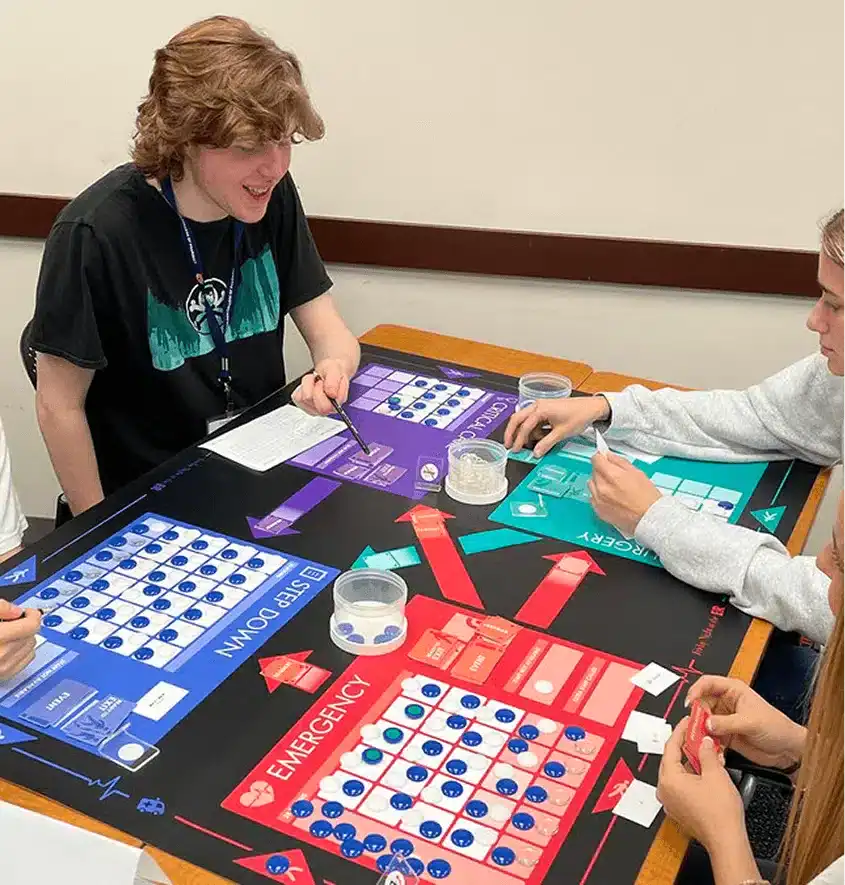 A team experiences the pressure of decision-making during the Friday Night at the ER® simulation.