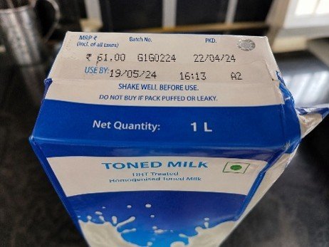 Toned milk carton with expiry date and storage instructions for food safety.