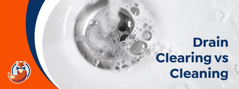 Close-up of water swirling down a sink drain, highlighting the difference between Drain Clearing vs Cleaning. "Drain Clearing vs Cleaning" text and a fox logo appear in the bottom left corner.