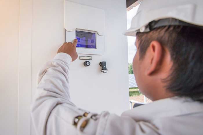 technician installing air conditioner