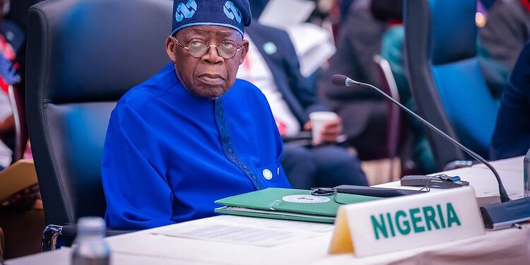 Nigerian delegate at international conference, wearing traditional blue outfit and sitting at a desk with Nigeria country label, engaged in global policy discussions about freelanews and freelance economy.