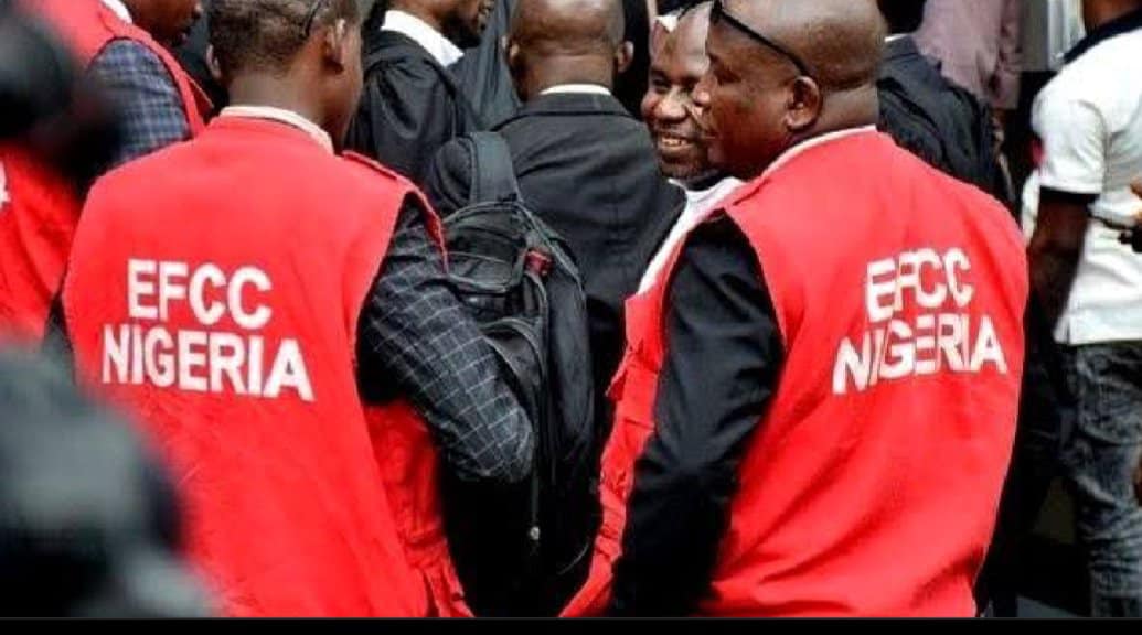 EFCC Nigeria officials in red jackets at a crime enforcement event.