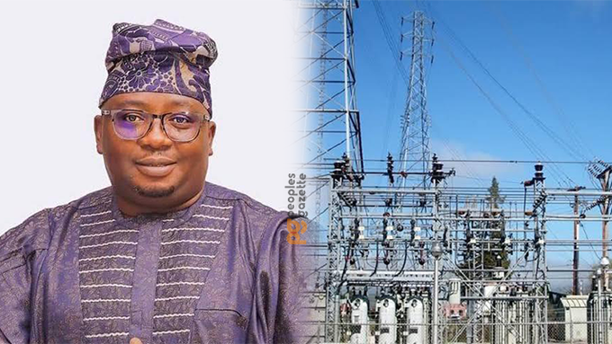 Informed and professional image of a man in traditional attire next to an electrical substation, symbolising energy infrastructure and technological development in Nigeria.