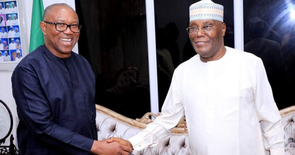 1. Two men shaking hands at a formal event, one in a dark shirt and the other in traditional white attire with a cap, smiling confidently.