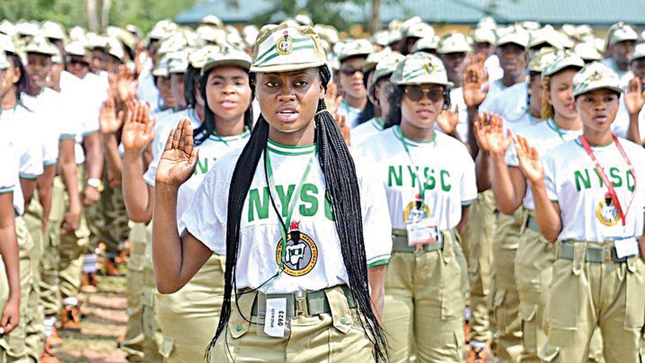 NYSLC girl cadets taking oath during national youth service training event in uniform.