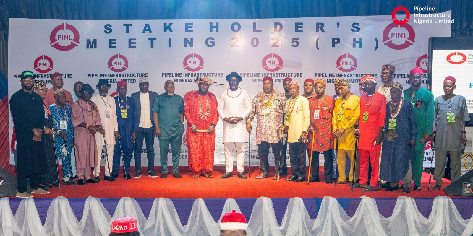 Stakeholders gather on stage during Nigeria pipeline infrastructure meeting, showcasing diverse traditional and modern attire at the 2025 pipeline infrastructure conference, highlighting Nigerian energy sector development.