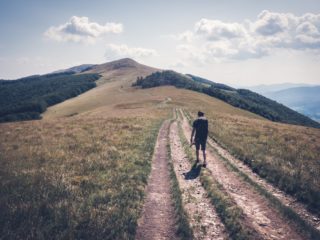Alone tourist hiking in the mountains