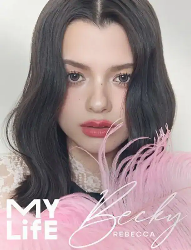 Becky Armstrong featured on the My Life Photobook 2025 cover, posing in a polished editorial portrait.