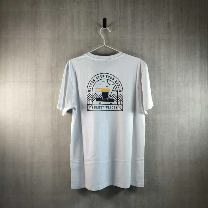 Fuerst Wiacek brewery branded T-shirt hanging on a wall with logo and design details.