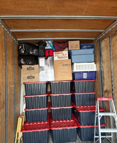 Moving boxes and supplies packed in a storage unit for a Calgary move.