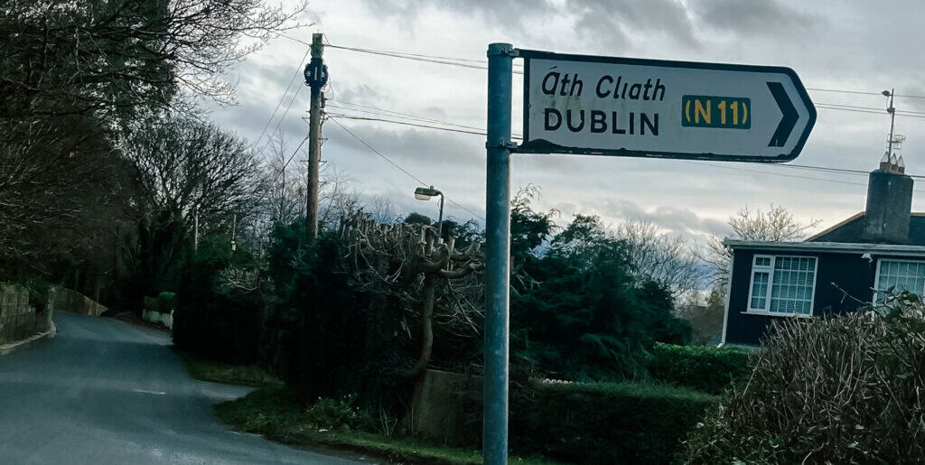 Bilingual road sign in Ireland showing Irish language place name