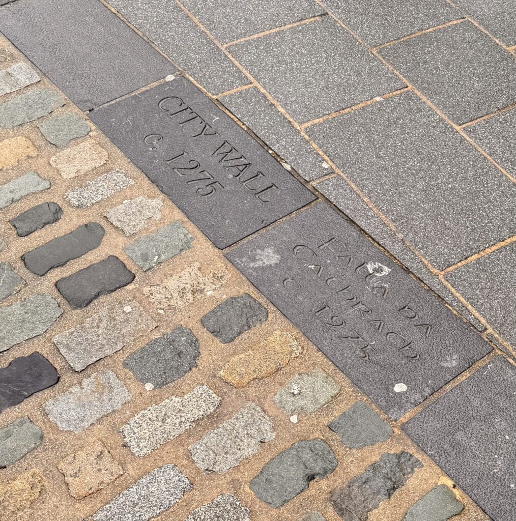 Historic city wall and cobblestones