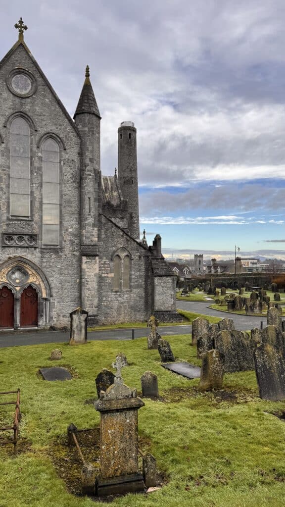 Historic cathedral with gravestones nearby