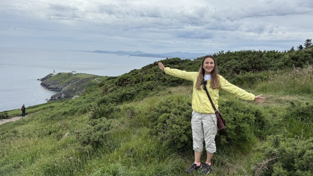 Visitor enjoying the Howth Head viewpoint on a private Dublin coastal tour