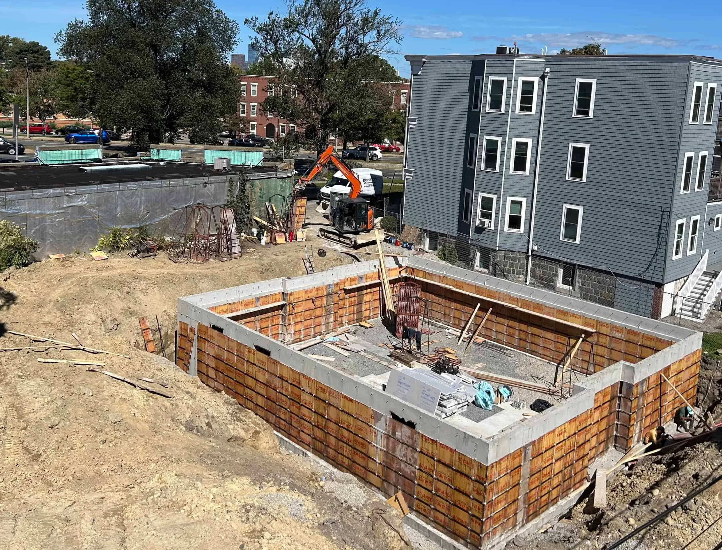 Pedestrian crosswalk at a busy Boston intersection with approaching vehicles