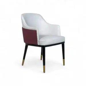 Luxurious modern dining chair with white and maroon upholstery, black legs with gold tips, perfect for stylish home decor.