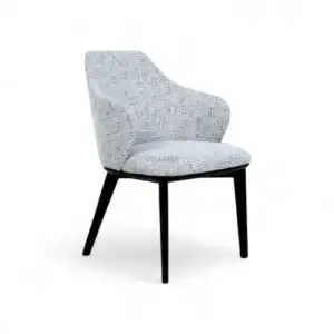 Contemporary upholstered dining chair with black wooden legs, stylish and comfortable for modern homes.