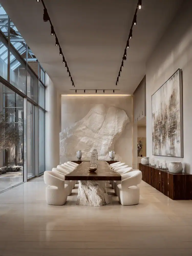 Elegant modern dining room with marble table and plush white chairs, showcasing luxury Geluoer Furniture design.