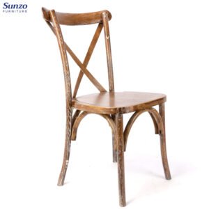 Rustic wooden dining chair with distressed finish, ideal for vintage or farmhouse decor.