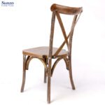 Rustic wooden chair with a natural finish, ideal for vintage or farmhouse decor.