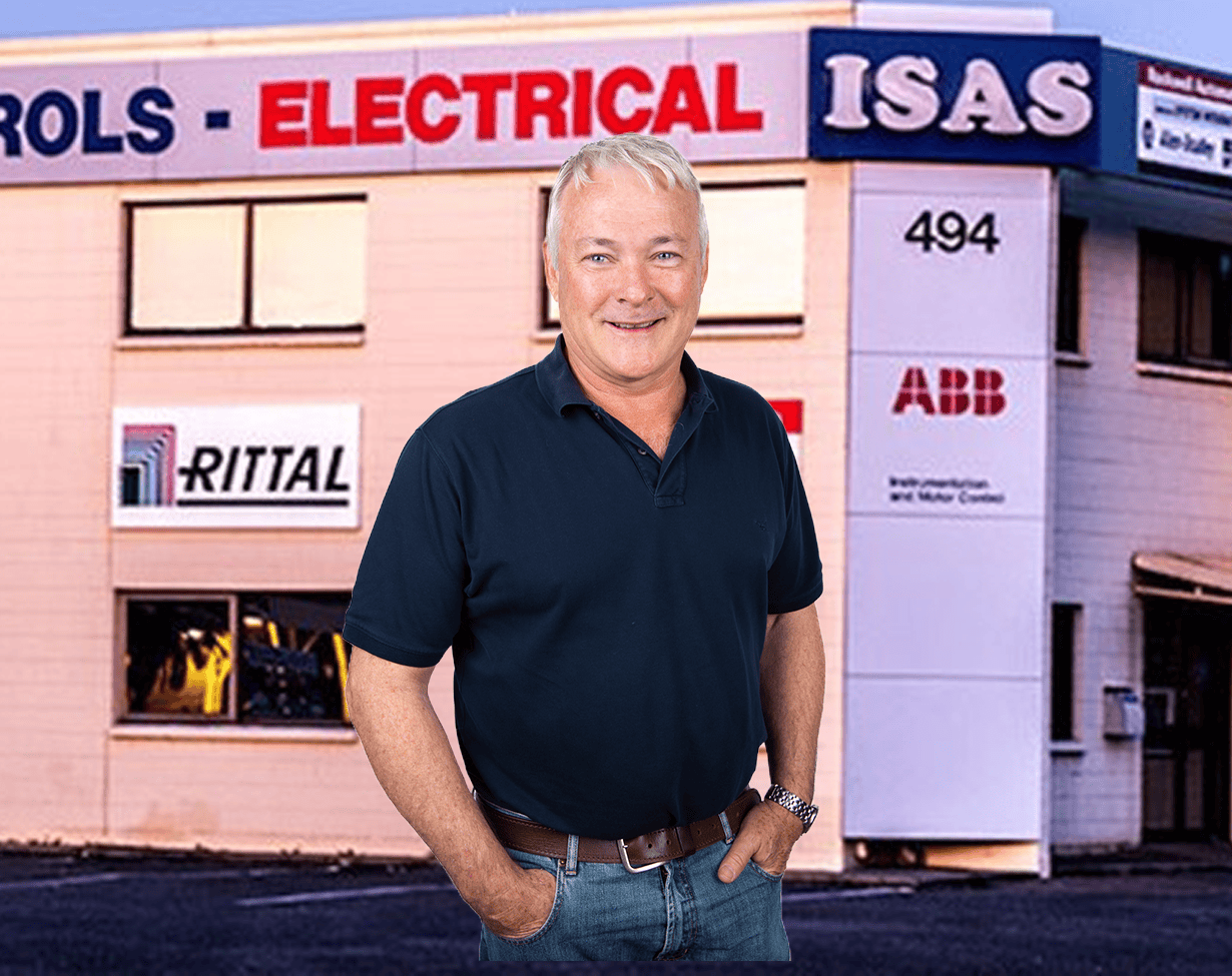 Friendly man standing outside Gemcell electrical store in Australia.
