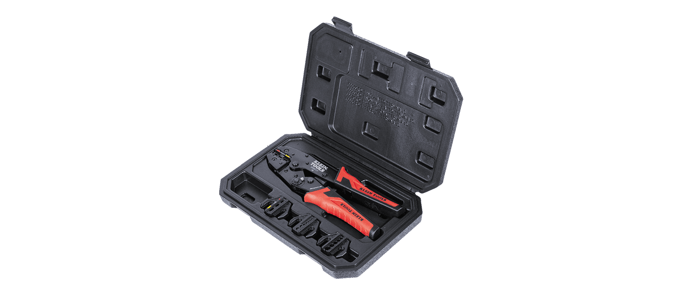 Precision screwdriver set with red and black handles in a black plastic case.