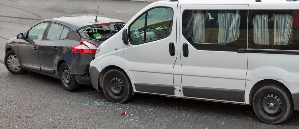 Car and van collision on the road in Australia, vehicle damage.